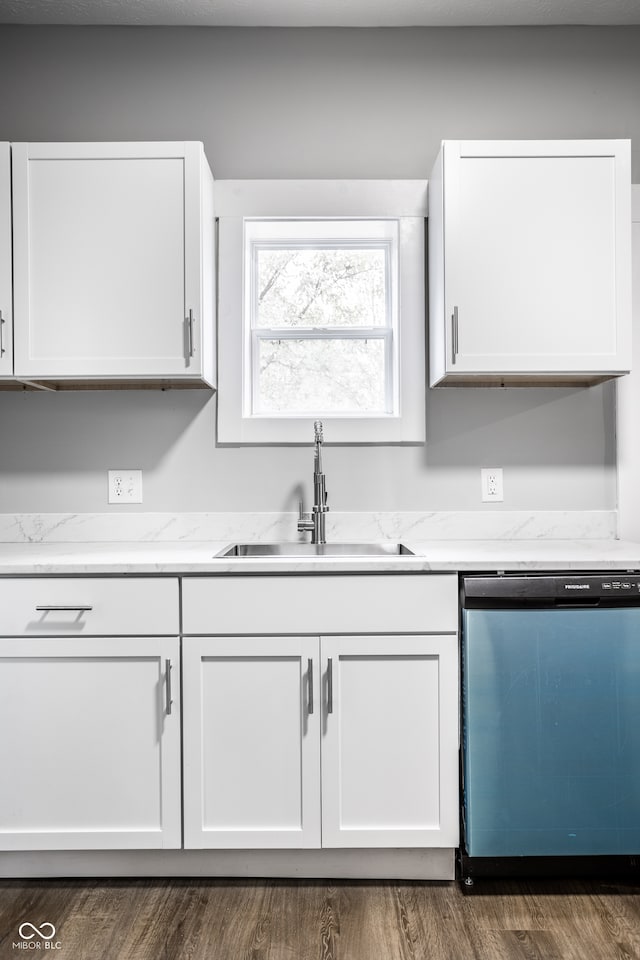 kitchen with dishwasher, dark hardwood / wood-style flooring, white cabinetry, and sink