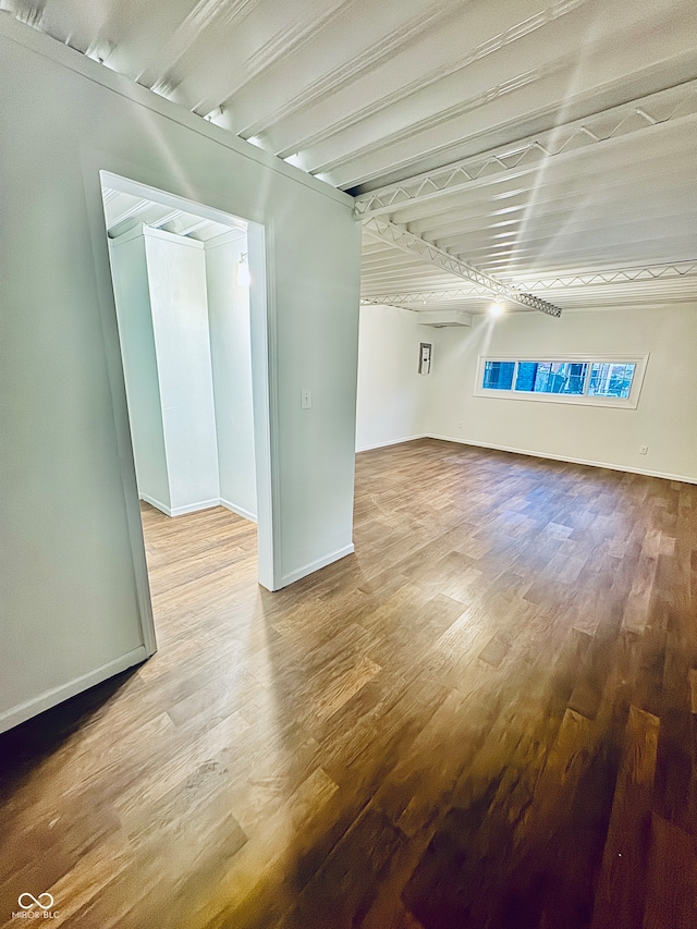 unfurnished room with hardwood / wood-style flooring