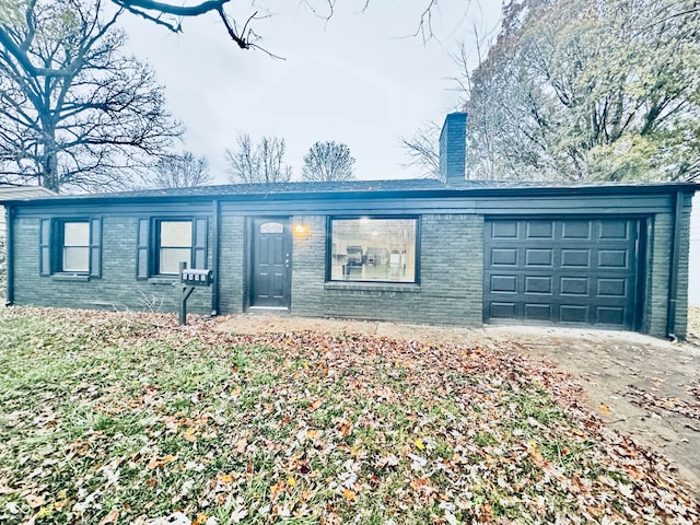 ranch-style house featuring a garage