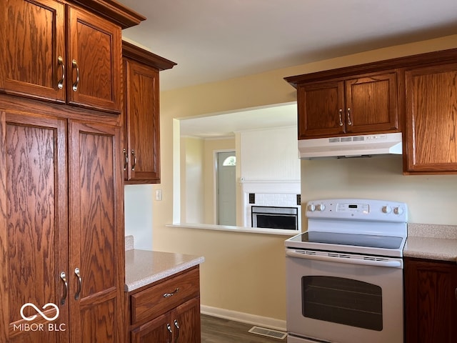 kitchen featuring dark wood-type flooring and white range with electric cooktop