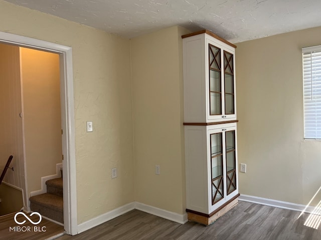 unfurnished room featuring hardwood / wood-style flooring