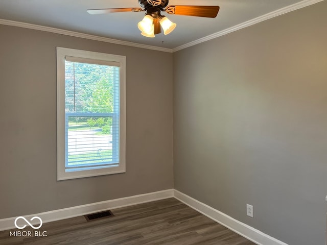 empty room featuring ornamental molding, ceiling fan, and dark hardwood / wood-style floors