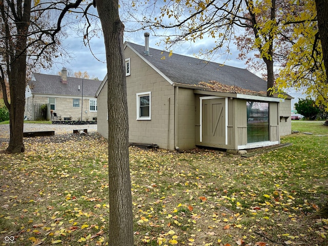 exterior space with a shed and a yard