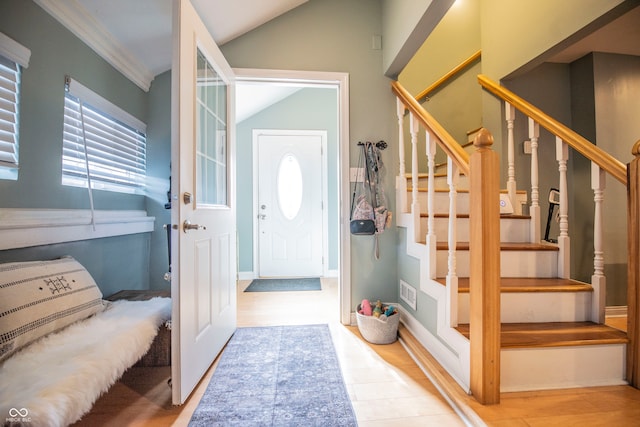 entryway with hardwood / wood-style flooring and lofted ceiling