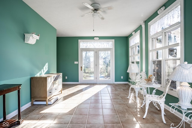 entryway featuring ceiling fan and light tile patterned floors