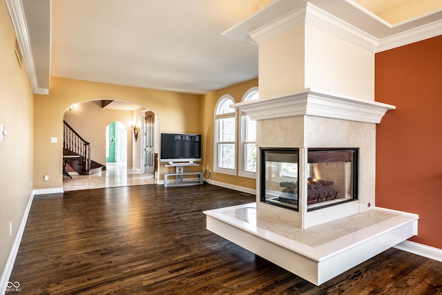 unfurnished living room with crown molding, hardwood / wood-style floors, and a high end fireplace