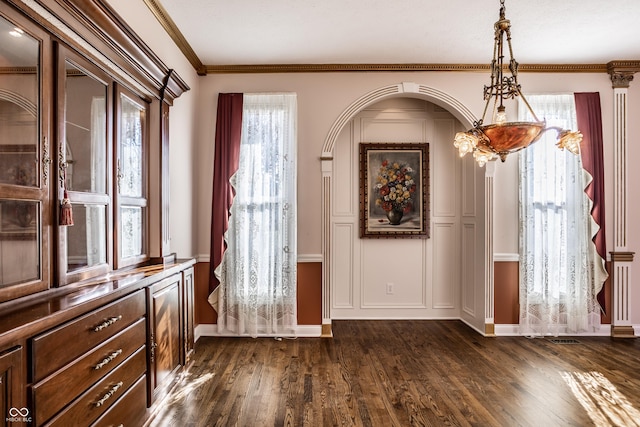 foyer featuring dark hardwood / wood-style floors and ornamental molding