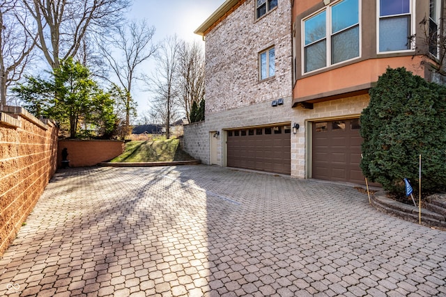 view of side of property featuring a garage