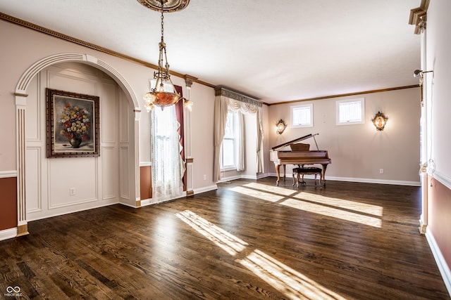 interior space featuring dark hardwood / wood-style flooring and ornamental molding