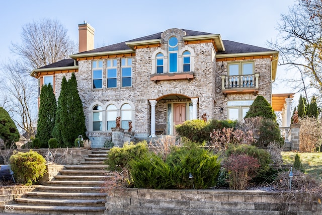 view of front of property with a balcony