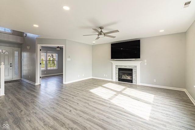 unfurnished living room with hardwood / wood-style floors and ceiling fan