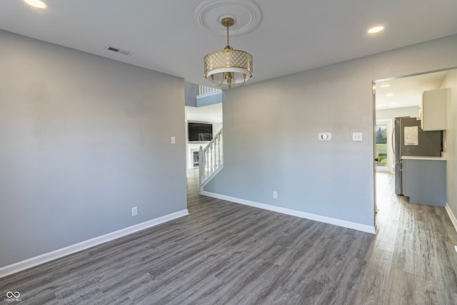 empty room with dark wood-type flooring