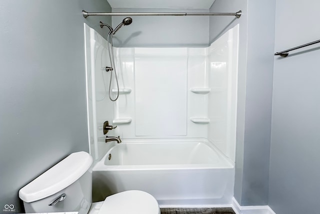 bathroom featuring toilet and tub / shower combination