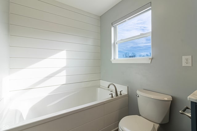 bathroom featuring a bathing tub and toilet