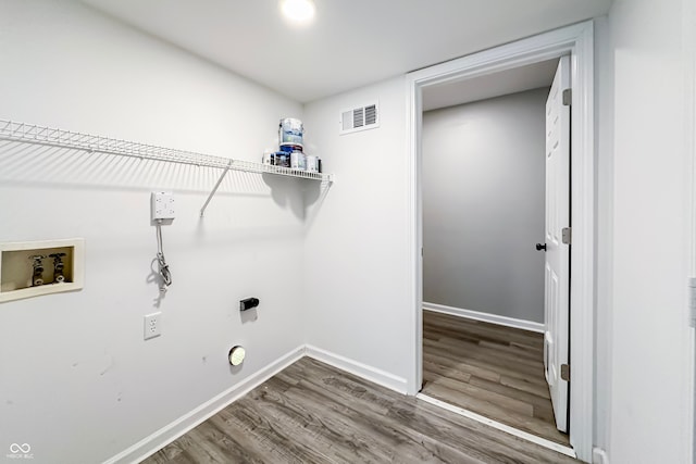 laundry area featuring hardwood / wood-style floors and hookup for a washing machine