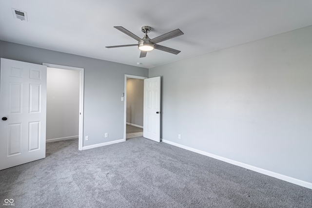 unfurnished bedroom with carpet floors, a closet, and ceiling fan