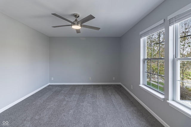 spare room featuring carpet flooring and ceiling fan