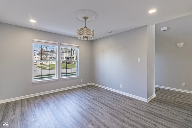 empty room featuring dark hardwood / wood-style flooring