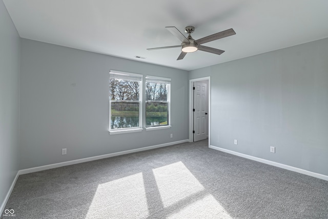 empty room with carpet floors and ceiling fan