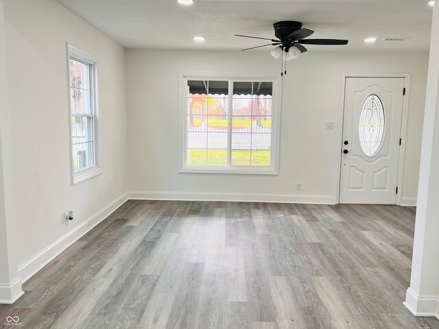 entrance foyer featuring ceiling fan and light hardwood / wood-style flooring