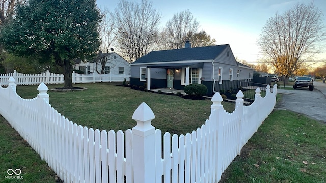 bungalow-style home featuring a lawn and a porch