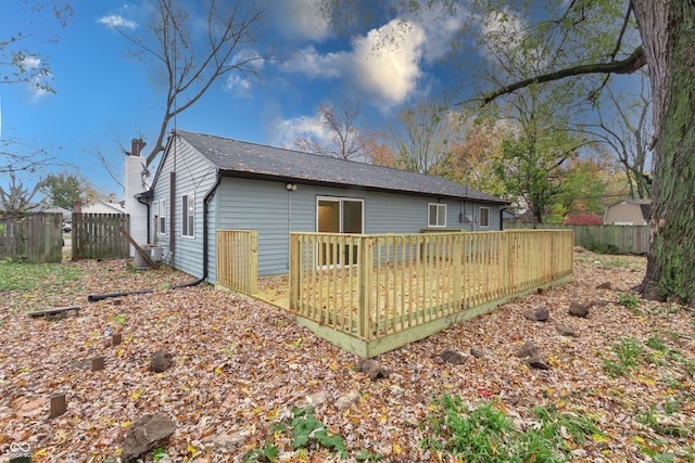 back of property with a wooden deck