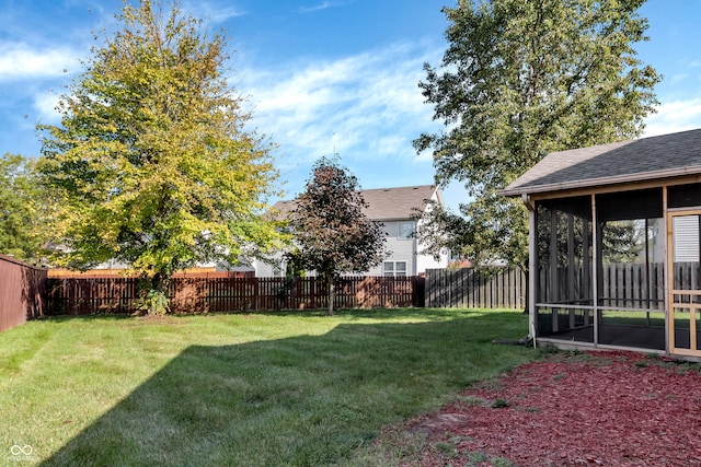 view of yard featuring a sunroom