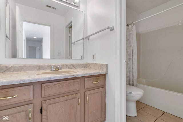 full bathroom with vanity, shower / tub combo with curtain, tile patterned flooring, and toilet