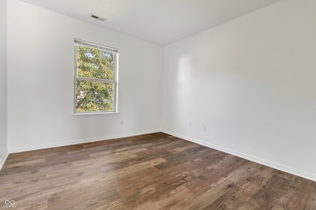 unfurnished room featuring hardwood / wood-style floors