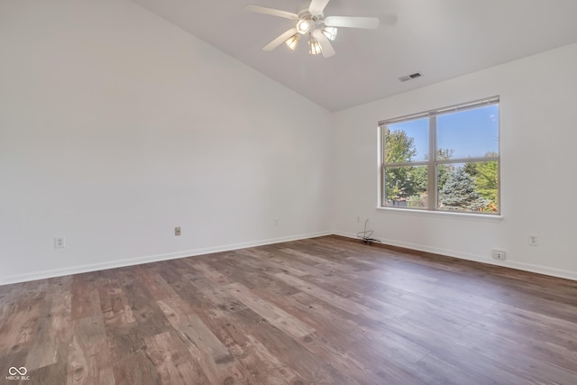 spare room with lofted ceiling, baseboards, ceiling fan, and wood finished floors