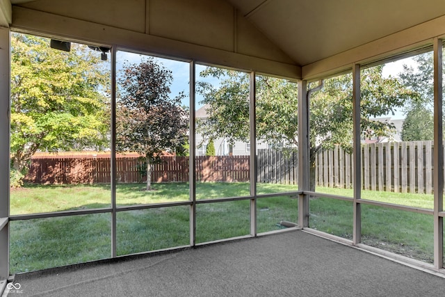 unfurnished sunroom with vaulted ceiling