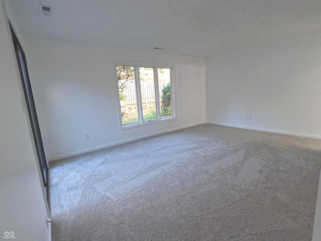 unfurnished room featuring carpet floors