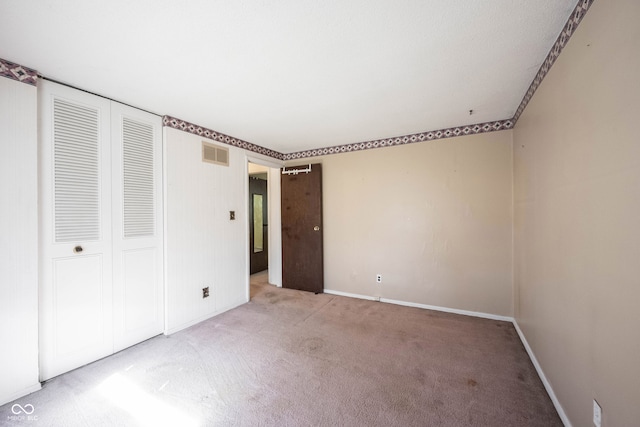 unfurnished bedroom featuring carpet