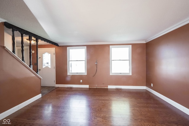 interior space with dark wood-type flooring and ornamental molding