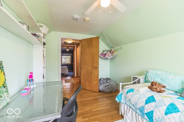 bedroom with light hardwood / wood-style floors, ceiling fan, and vaulted ceiling