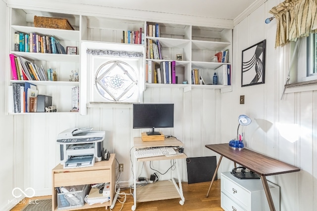 office space featuring ornamental molding and hardwood / wood-style floors