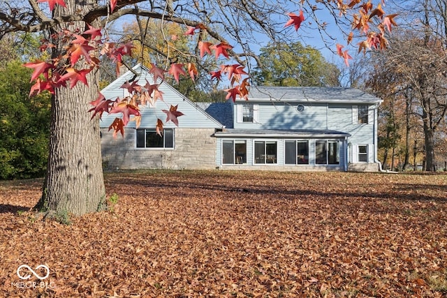 back of house featuring a sunroom