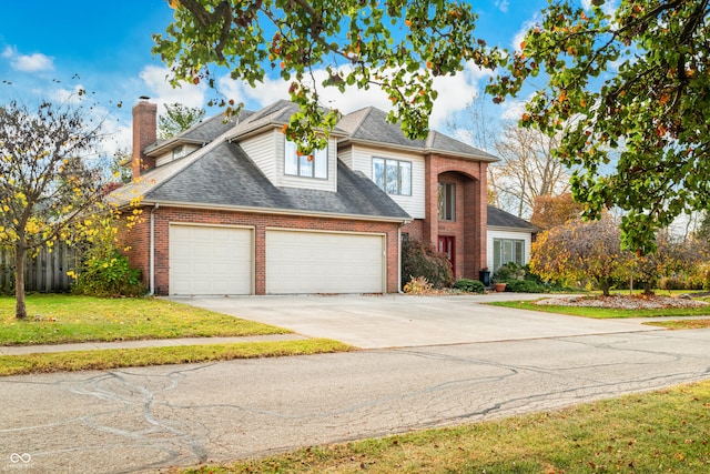 view of front facade with a garage and a front lawn