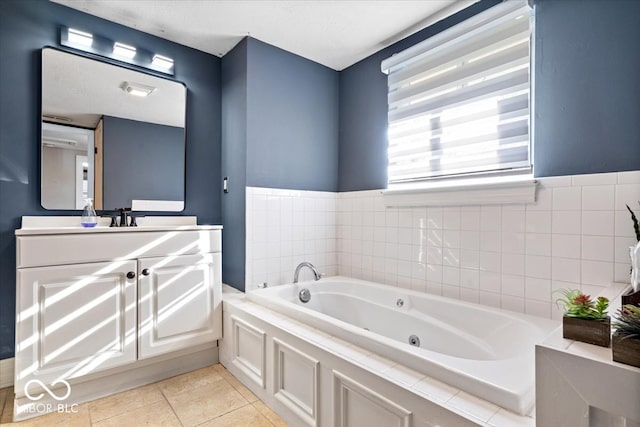 bathroom featuring tile patterned floors, a washtub, and vanity