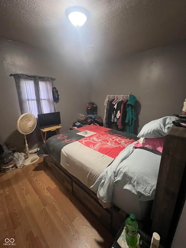 bedroom featuring hardwood / wood-style floors