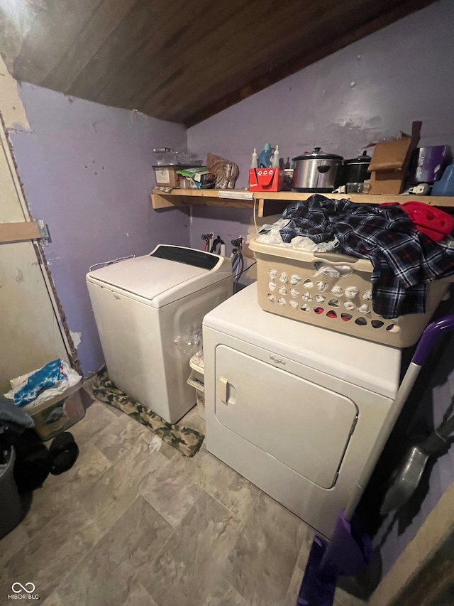 laundry room featuring wooden ceiling and washing machine and clothes dryer