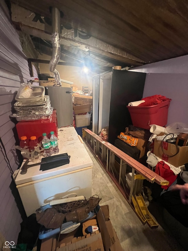 basement featuring wooden walls