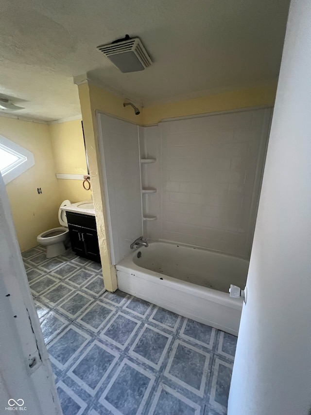 full bathroom featuring tiled shower / bath, vanity, toilet, and tile patterned floors