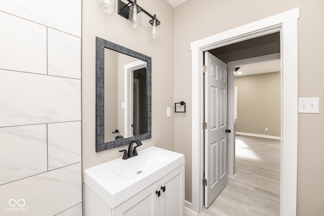 bathroom with hardwood / wood-style flooring and vanity