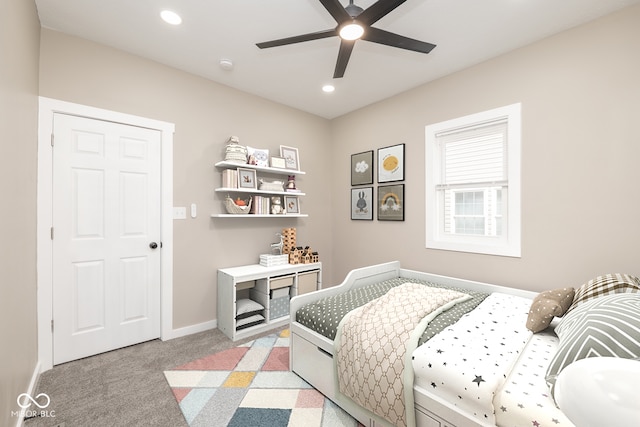 bedroom with light colored carpet and ceiling fan