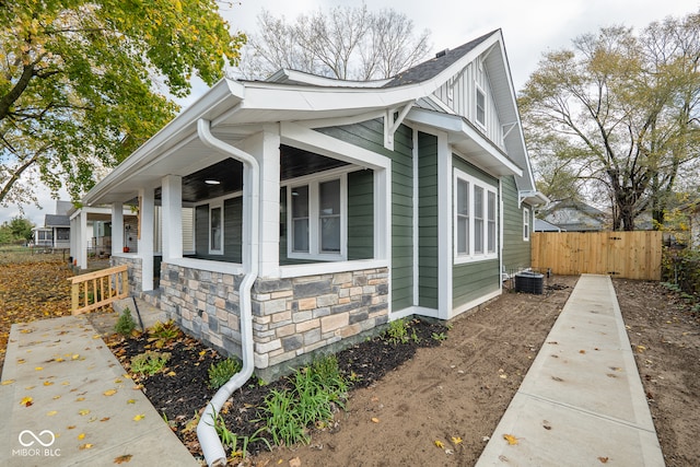 view of side of property featuring central AC unit