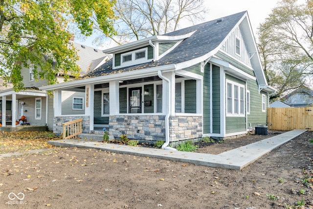 view of front of property with central AC unit and a porch