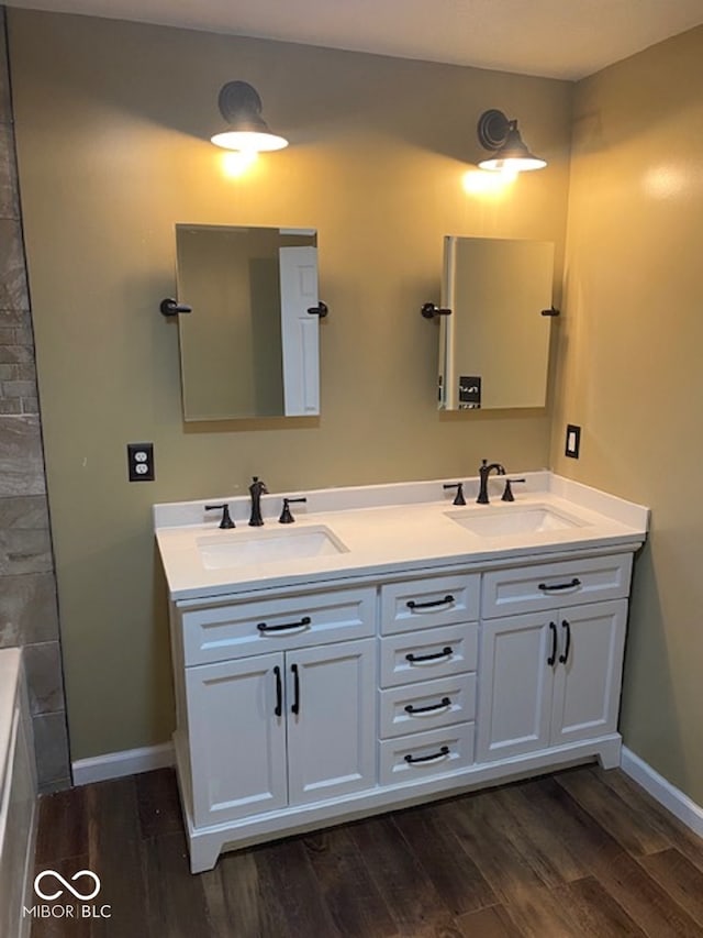 bathroom with vanity and hardwood / wood-style floors