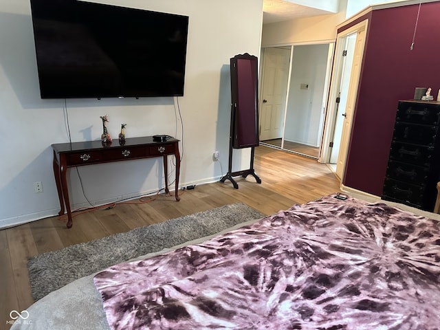 bedroom featuring a closet and light hardwood / wood-style flooring