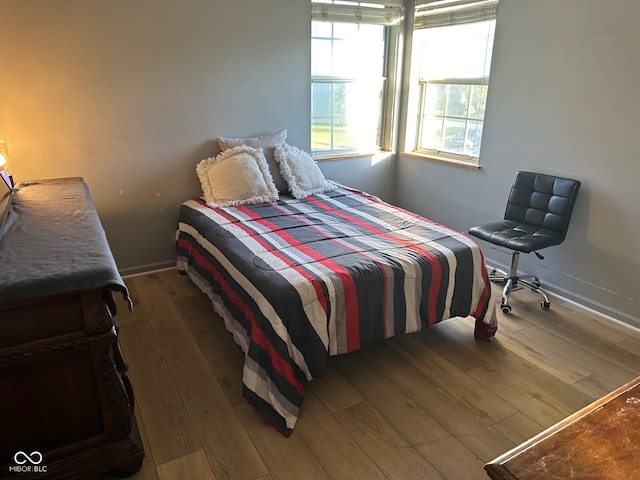 bedroom with hardwood / wood-style floors